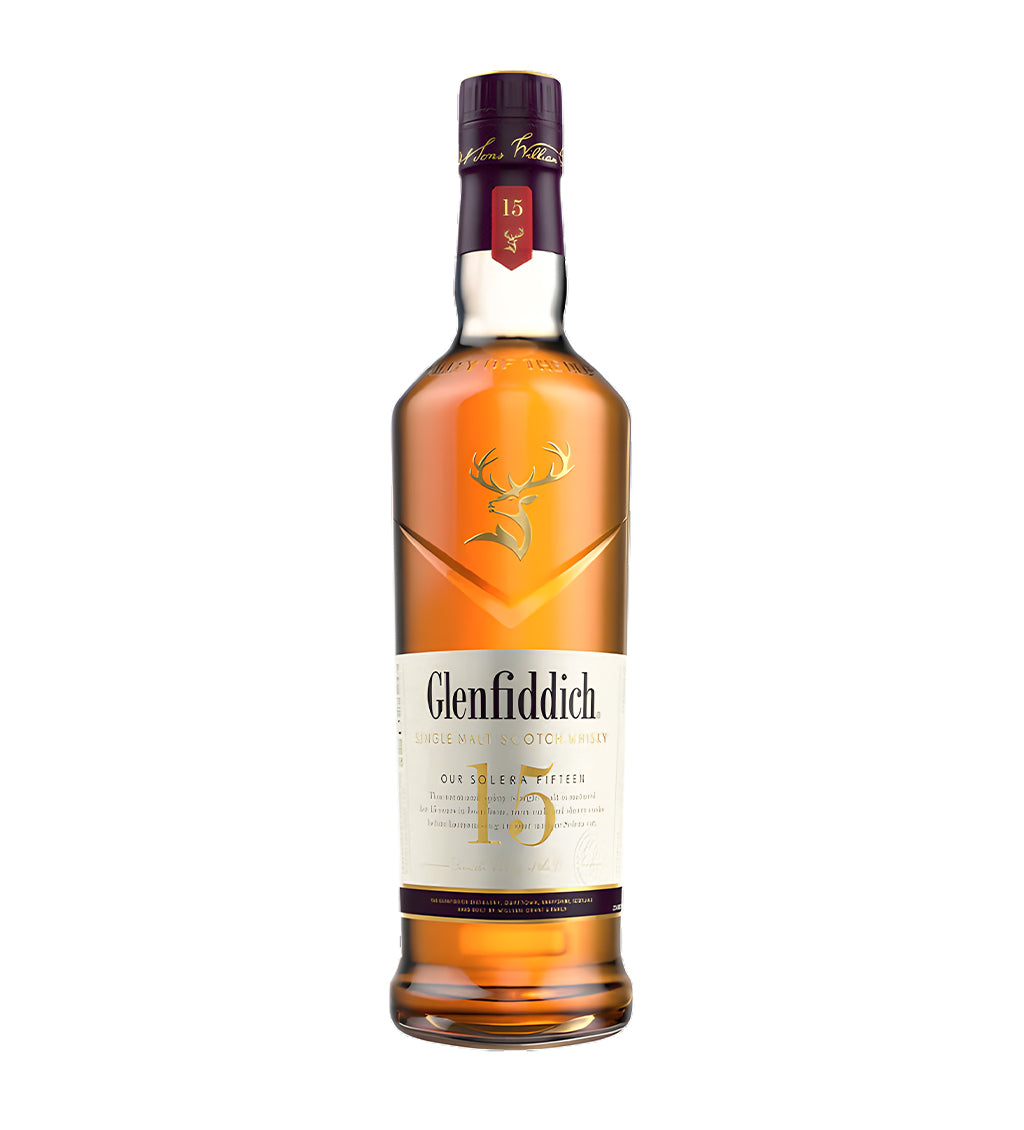 Glenfiddich 15 Years Solera Reserve Single Malt Scotch Whisky 1L clear glass bottle on white background, golden amber spirit with burgundy and gold label featuring stag logo