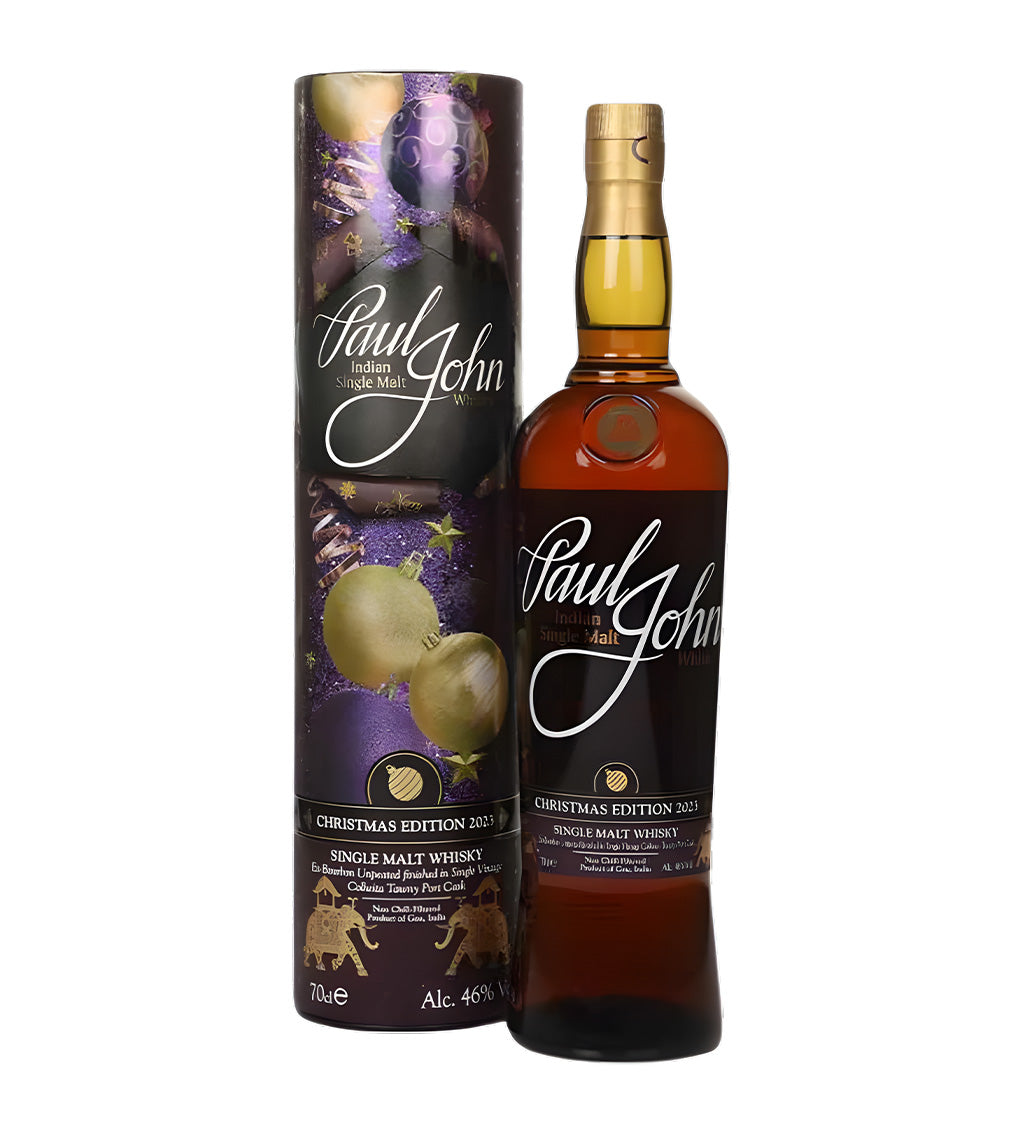 Festive edition, amber whisky, Paul John label with Xmas 2022 details, white background, subtle warm lighting.