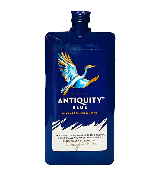 Antiquity Blue Premium Whisky 18cl clear glass bottle on white background, golden amber spirit with deep blue and gold label featuring brand crest