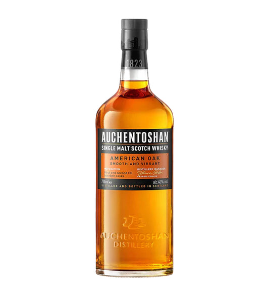 Auchentoshan American Oak Single Malt Scotch Whisky 70cl clear glass bottle on white background, golden spirit with white and orange label featuring distillery logo and oak barrel detail
