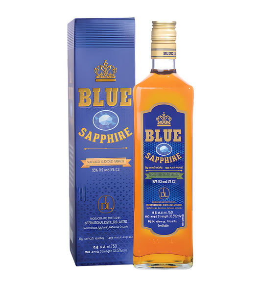 Blue Saphire Whisky 75cl clear glass bottle on white background, golden amber spirit with deep blue and silver label featuring brand crest