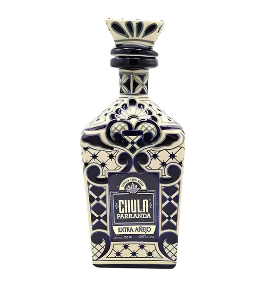 Chula Parranda Extra Añejo Tequila 37.5cl blue and white ceramic bottle on white background, intricate design with agave motif
