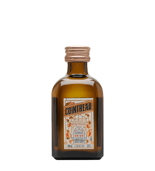 Bottle of Cointreau liqueur on a white background