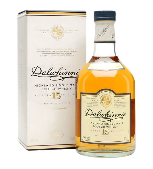 Dalmore 18 Years Highland Single Malt Scotch Whisky 70cl clear glass bottle on white background, dark amber spirit with black and copper label featuring stag emblem
