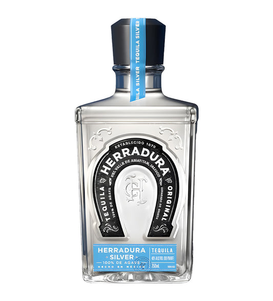 Herradura Plata Tequila 70cl clear glass bottle on white background, clear spirit with silver horseshoe logo and white label featuring agave imagery