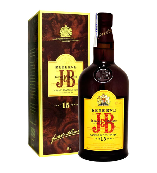 J & B 15 Years Blended Scotch Whisky 1L clear glass bottle on white background, golden amber spirit with green and gold label featuring brand crest and age statement