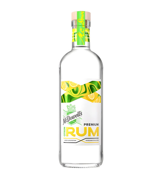 McDowell’s No.1 X Premium Citrus Rum 75cl clear glass bottle on white background, yellow label with citrus imagery and brand logo