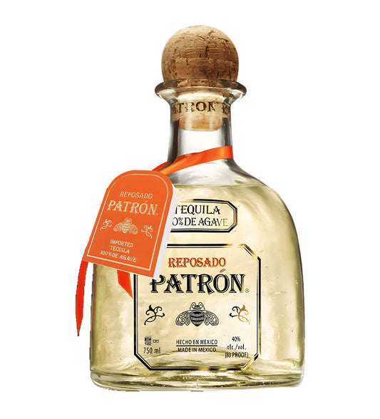 Patrón Reposado Tequila 75cl clear glass bottle on white background, golden spirit with cork stopper and cream label featuring agave design