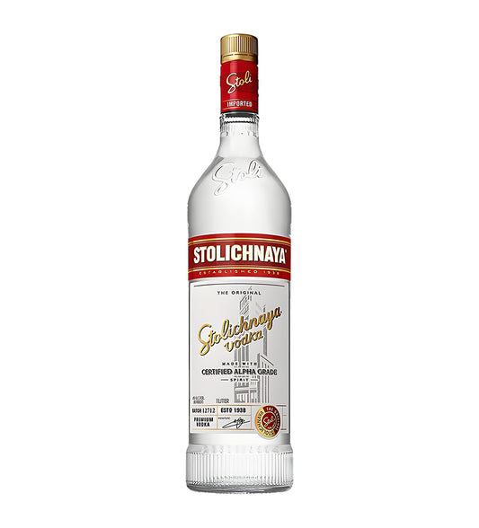 Stolichnaya Vodka 1L clear glass bottle on white background, white and red label with gold accents and brand logo