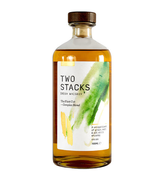 70cl blended whisky, amber liquid, “The First Cut” label, cinematic lighting emphasizing bottle details and liquid clarity, realistic glass reflections, soft shadows, clean background.